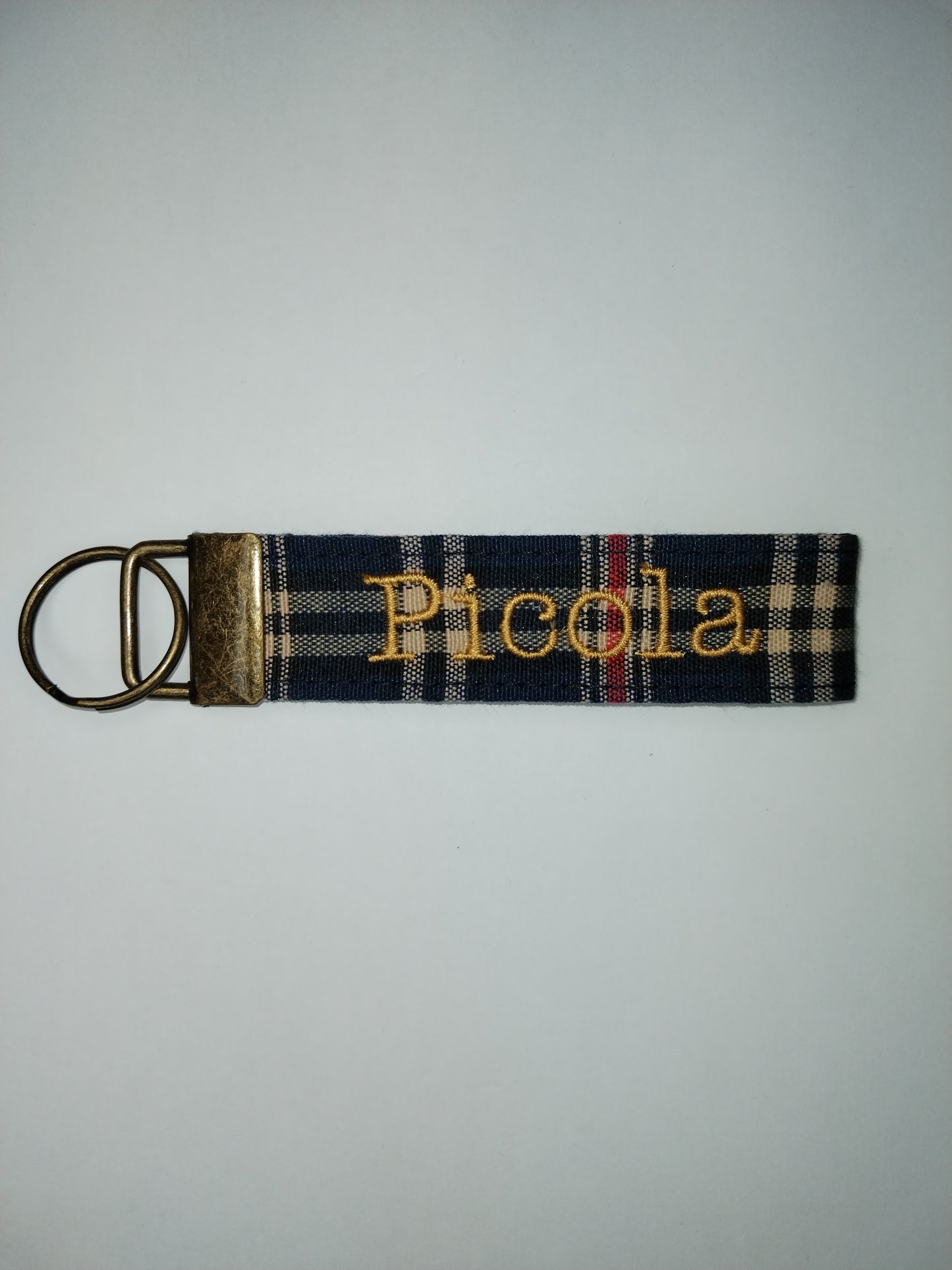 Llavero con anilla color bronce, estampado a elegir.